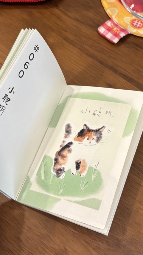 A small art zine with an illustrated cat
